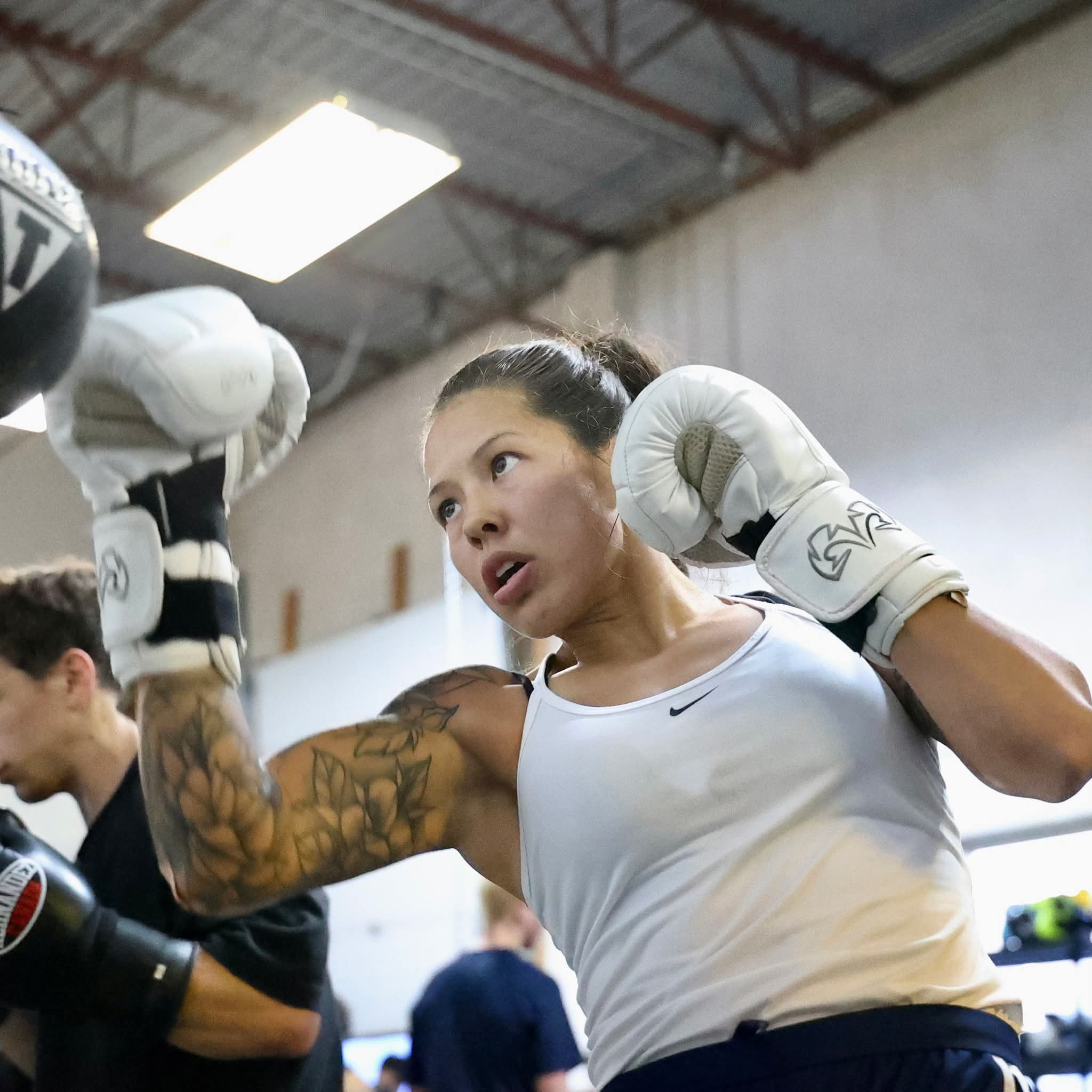 Amber Jane Wall training with boxing gloves at the gym