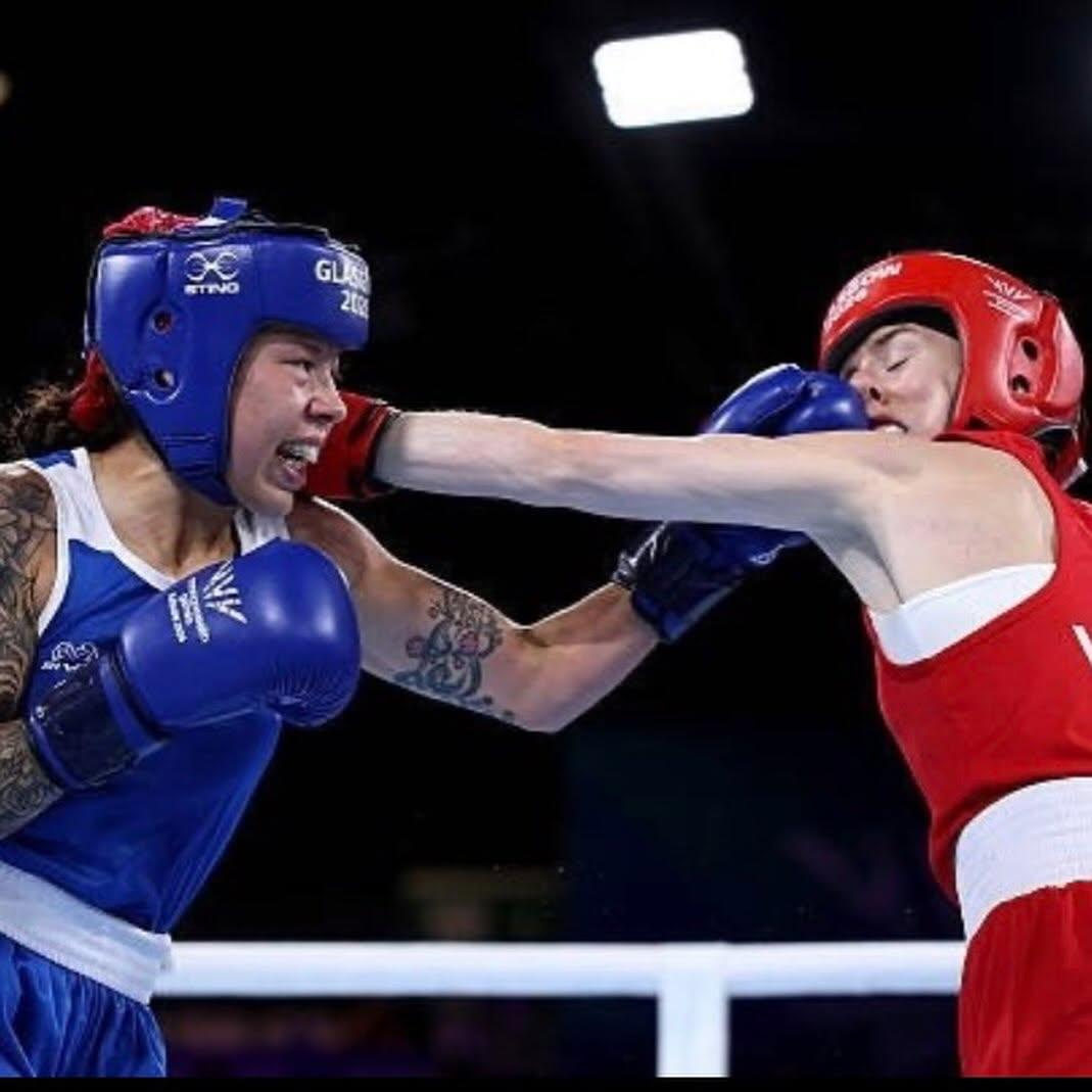 Two boxers exchanging punches in the ring